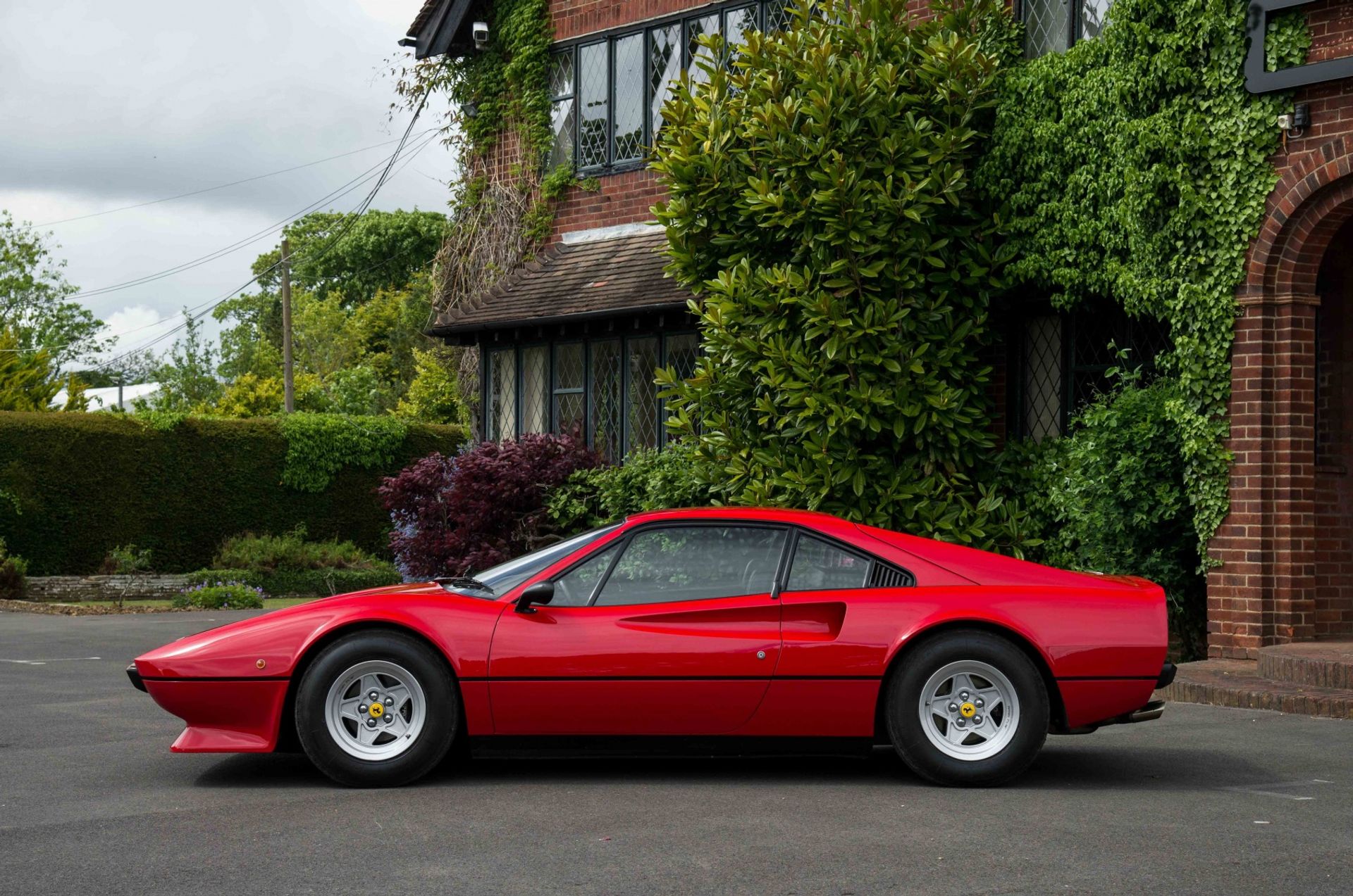 The side profile of a rosso 308 GTB at GTO House